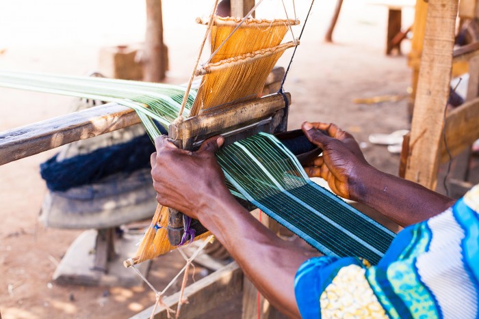 Artisan weaving Aso Oke fabric at the Aso Oke Weaving Centre in Ilorin