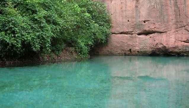 Wikki Warm Springs, one of the natural historical sites in Nigeria, surrounded by lush greenery.