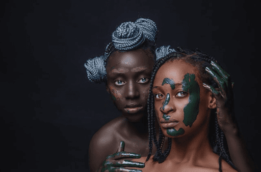 Two ladies showcasing the beauty of art as a way to spend a Gen Z weekend in Lagos 