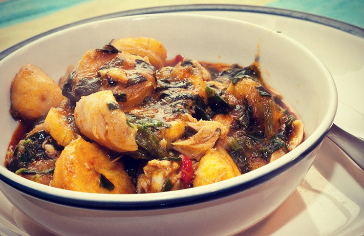  A picture of Ukang plantain porridge made with ripe plantain and smoked fish, a familiar local dish to try in Akwa Ibom during the holidays.