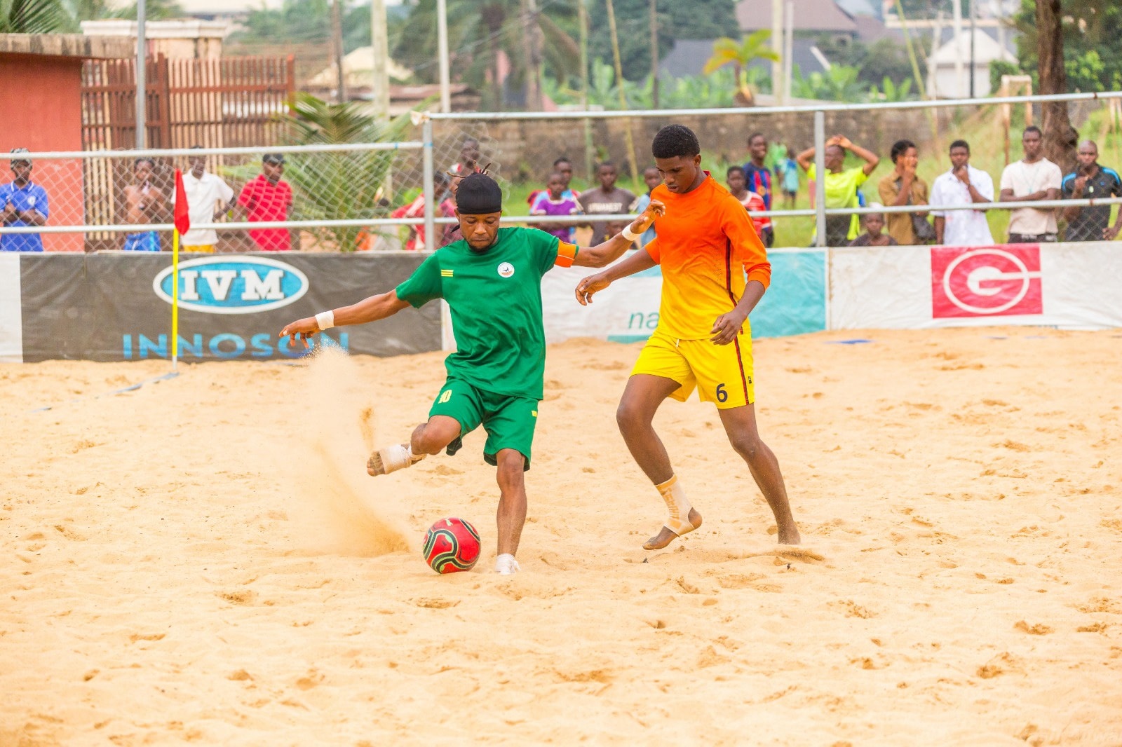 Battle for possession on the sand 
