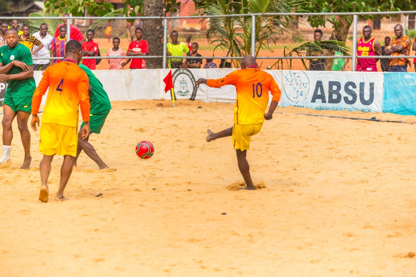 Player strikes the ball during Nigerian Beach Soccer League 2025 action
