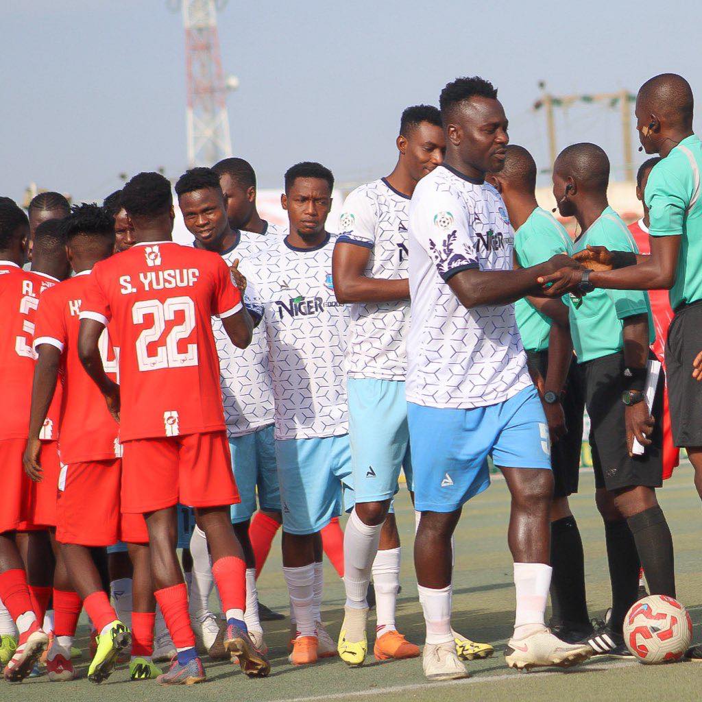 Match officials conduct pre-match formalities as teams line up before kickoff at NPFL fixture
