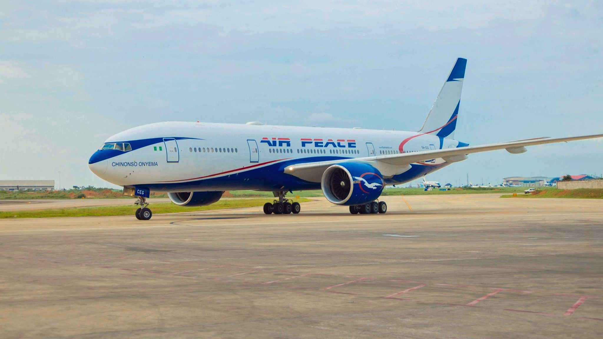 Aeroplane from Air Peace taking off from Lagos airport symbolises Nigeria’s expanding aviation and new flight routes in 2026.
