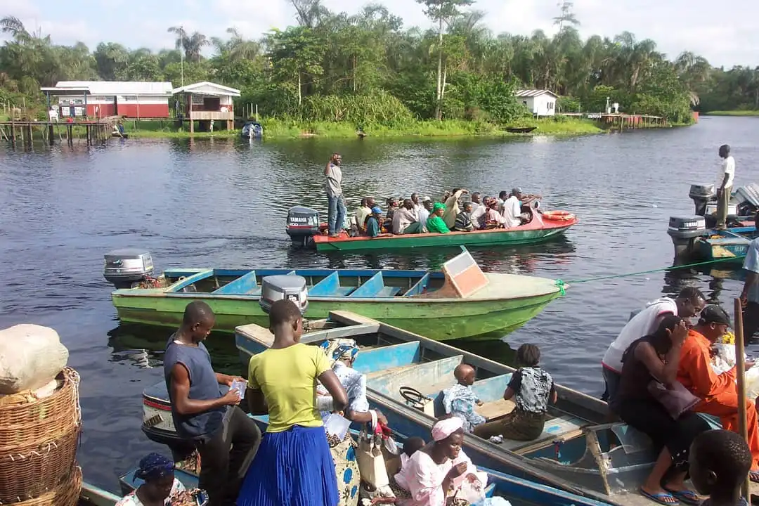 People on a boat at Igbokoda waterfront, one of the underrated tourist attractions in Ondo.
