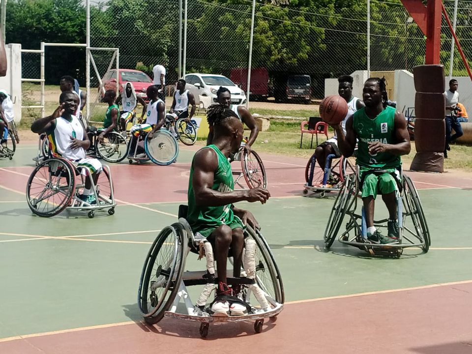 Para-athletes competing in a wheelchair basketball match during a training session in Nigeria
