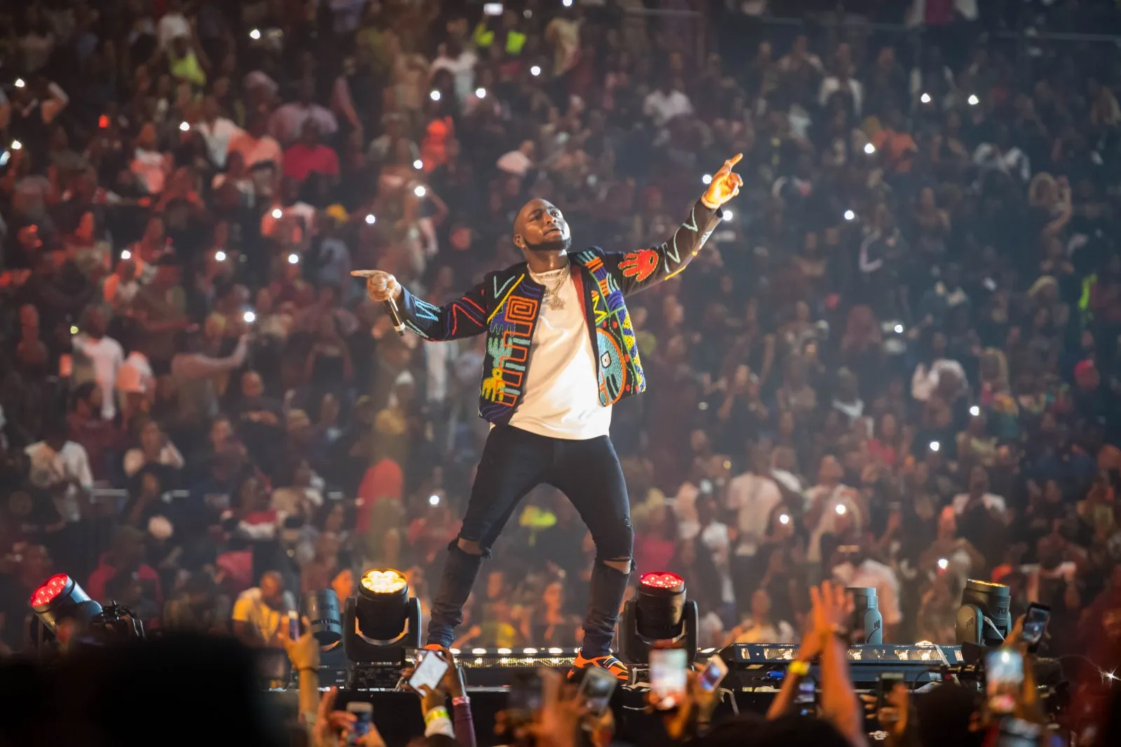 Davido performing on stage during a Detty December concert