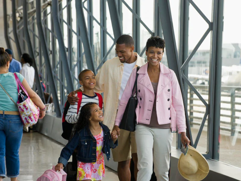  Happy family travelling to one of the top 10 Places to Spend Christmas in Nigeria