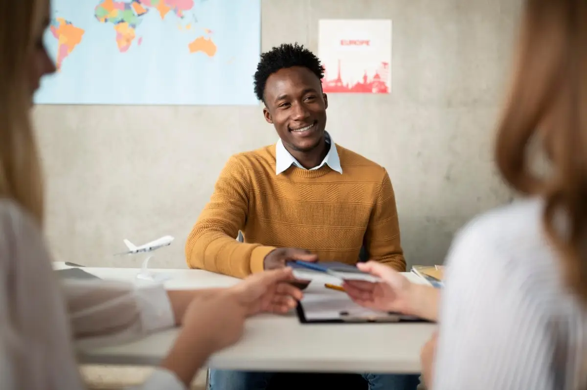  Easiest and Hardest Visas for Nigerian Travellers: a happy Nigerian man receiving his visa.
