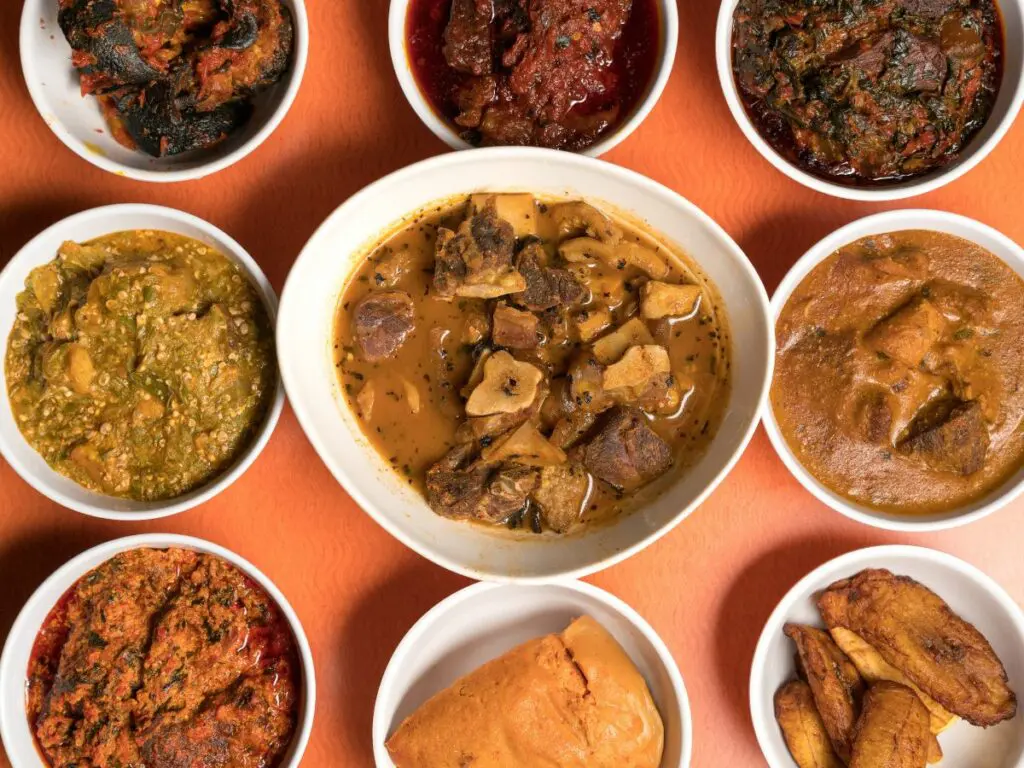 Why Nigeria Is Not a “One-City” Country: Different native Nigerian soups displayed on a table.
