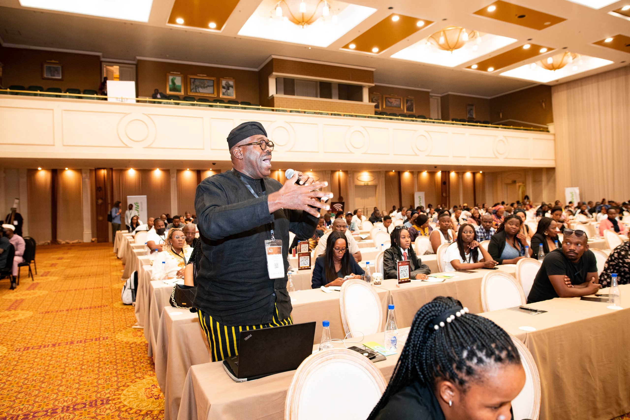 A man trying to make a point in an African Tourism conference.